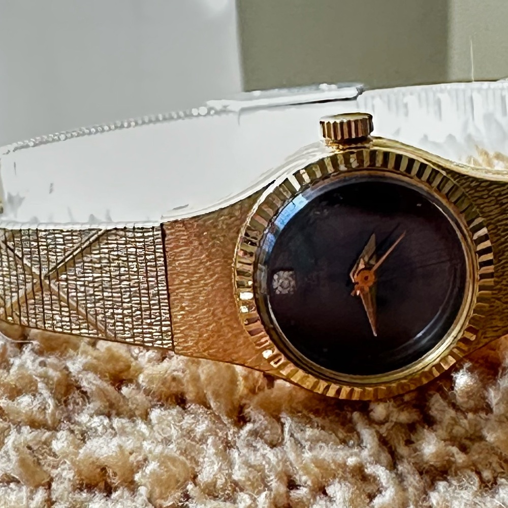 Vintage Lorus Gold and Silver Watch with black face and diamond